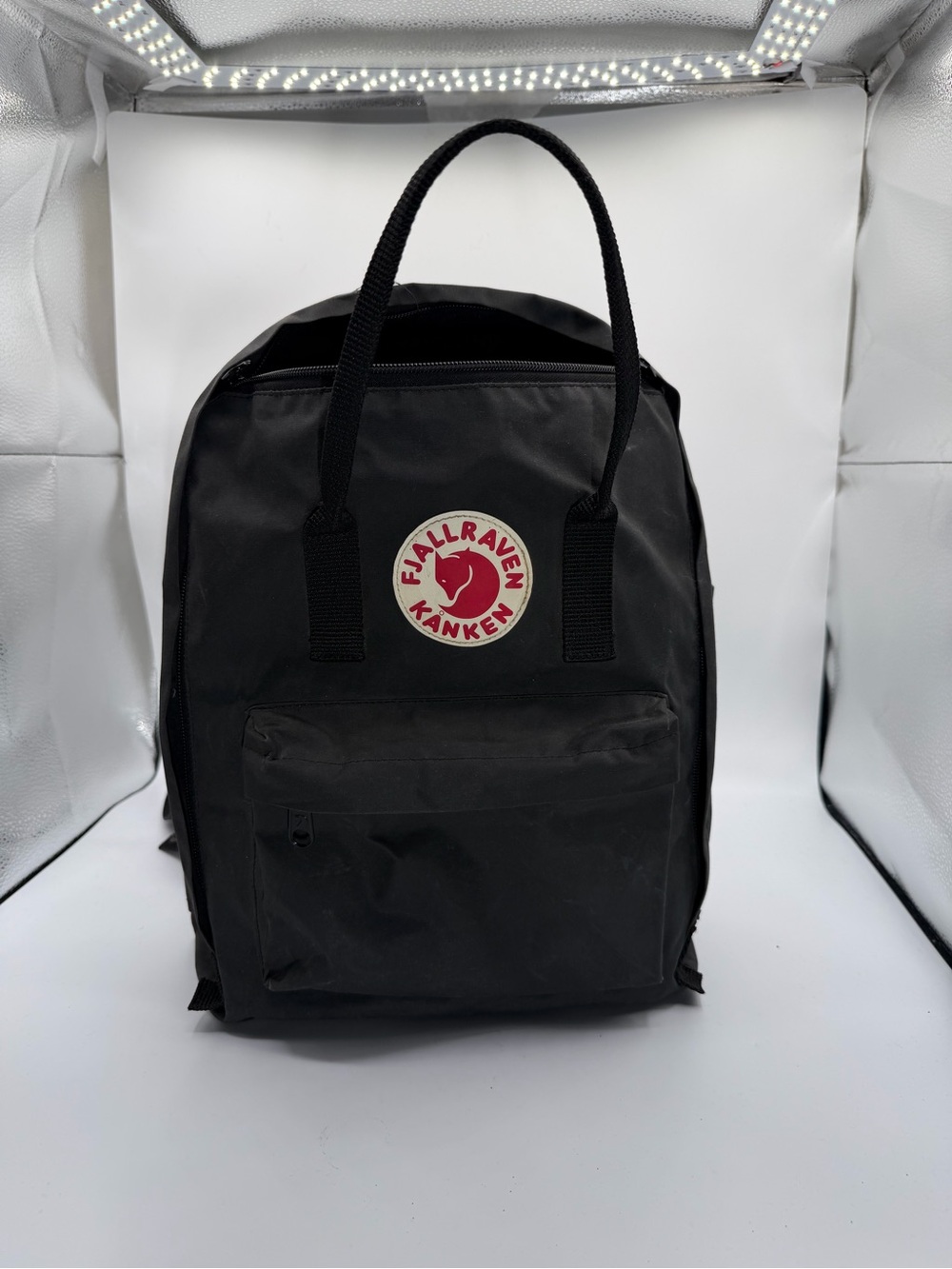 Fjallraven Kånken Backpack in Black with Red and Cream Logo